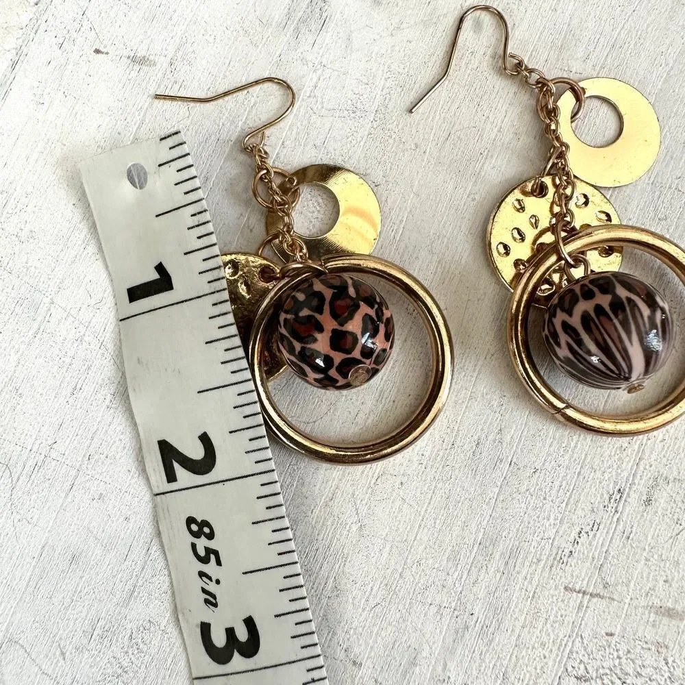 Gold tone charm drop earrings
